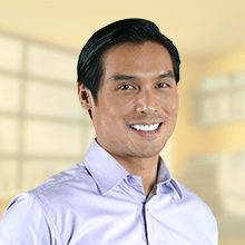 Headshot of Jay, an entrepreneur and Sun Life financial advisor, showcasing a happy and satisfied smile.